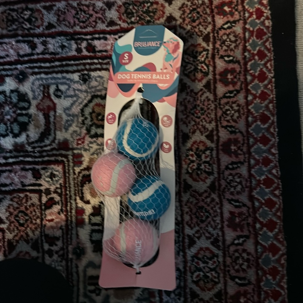 Blue and pink dog tennis balls